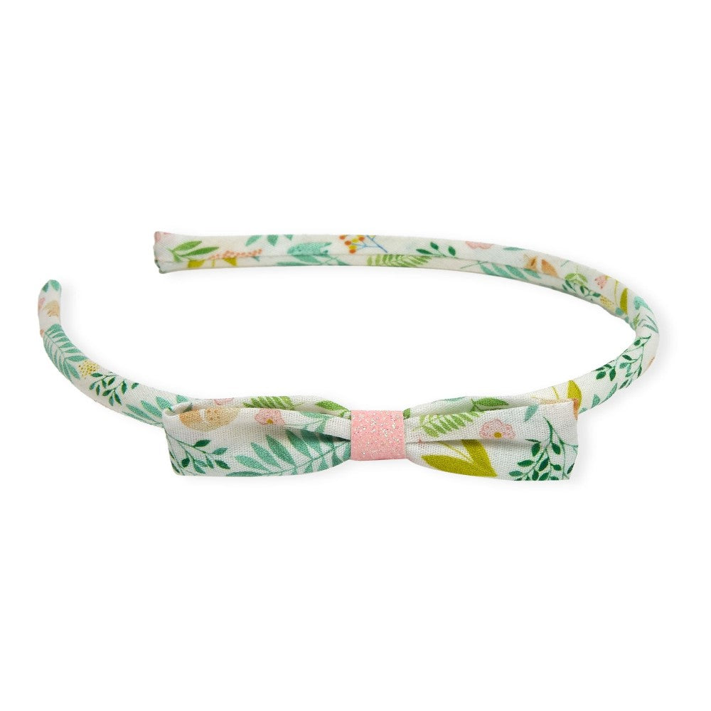 Floral headband with a pink bow on a white background