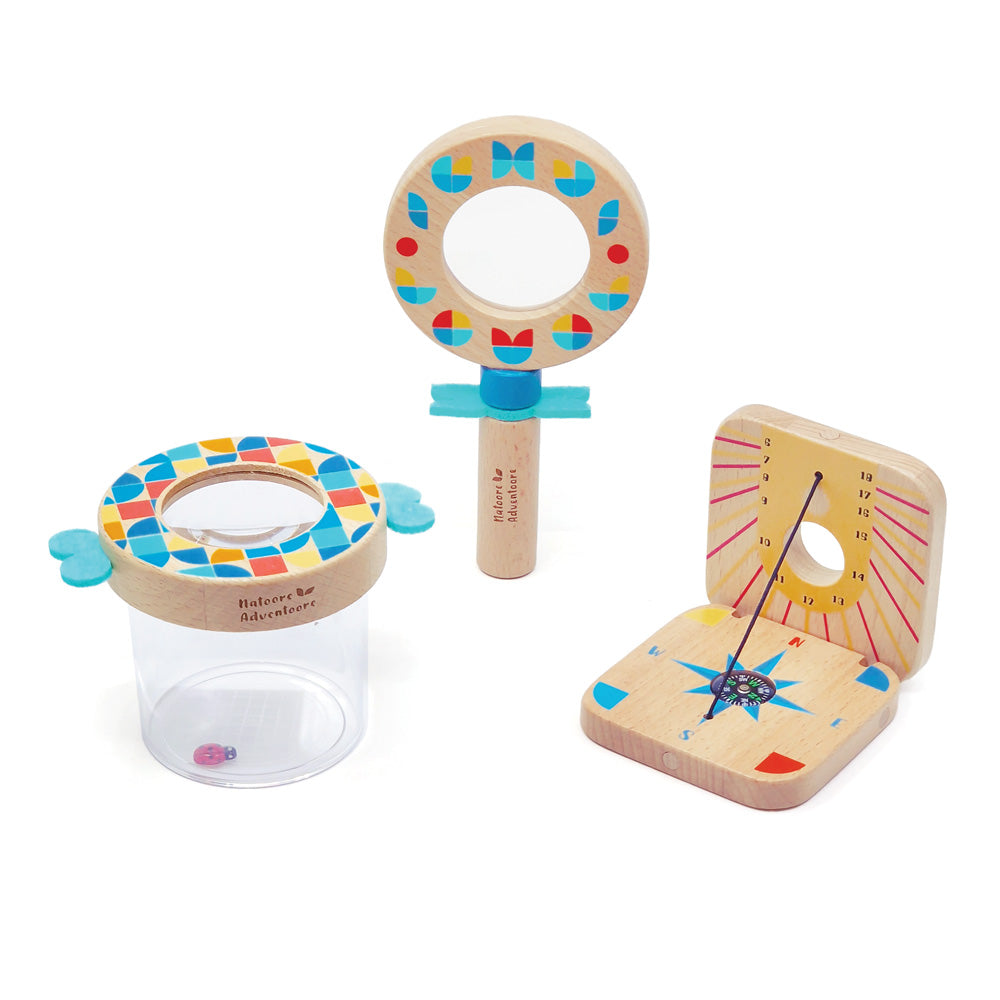 Set of wooden toys including a magnifying glass, a sun-shaped object, and a cylindrical container on a white background.