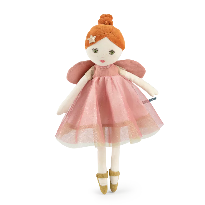 Stuffed doll with a pink dress and red hair on a white background