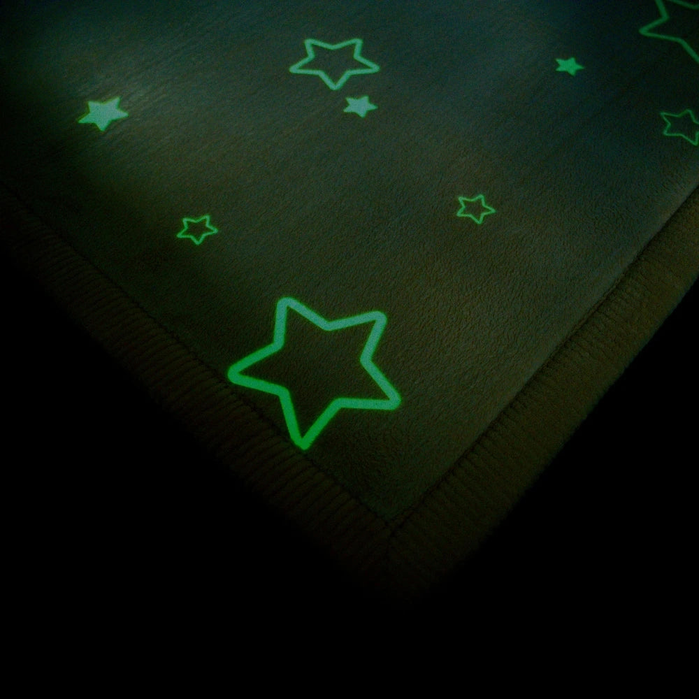 Glowing green star shapes on a dark fabric surface