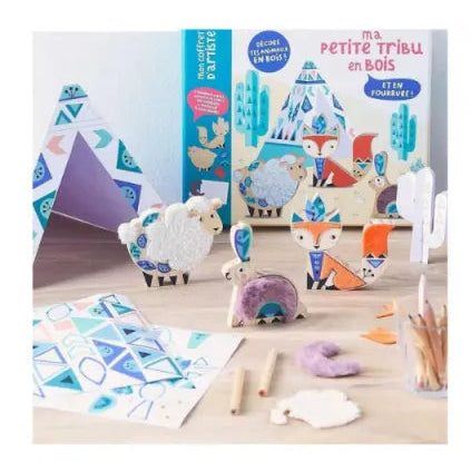 Children's educational toys and materials on a wooden surface with a 'Ma Petite Tribu' box in the background.