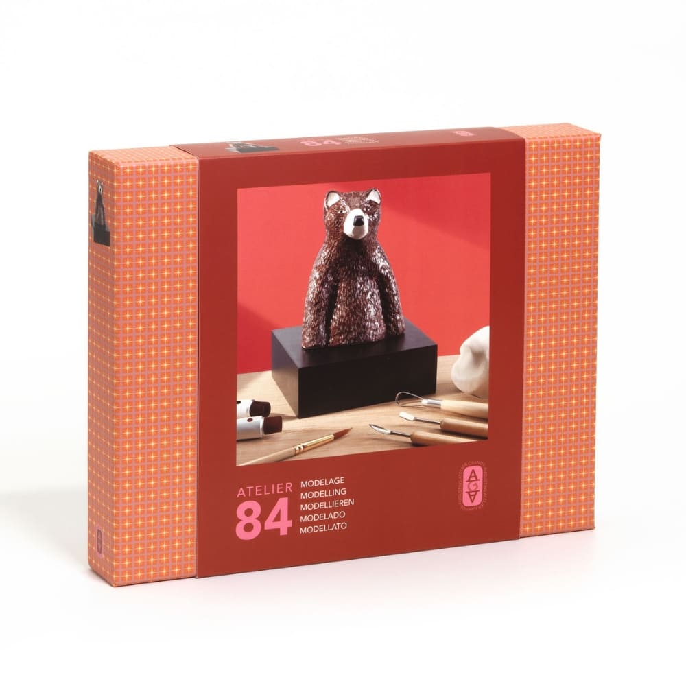 Boxed sculpture of a bear with a red background