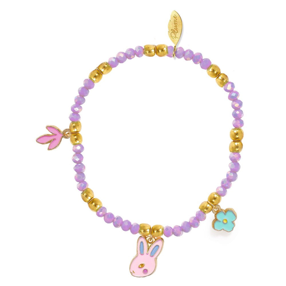 Bracelet with pink bunny charm, gold beads, and a leaf-shaped tag on a white background
