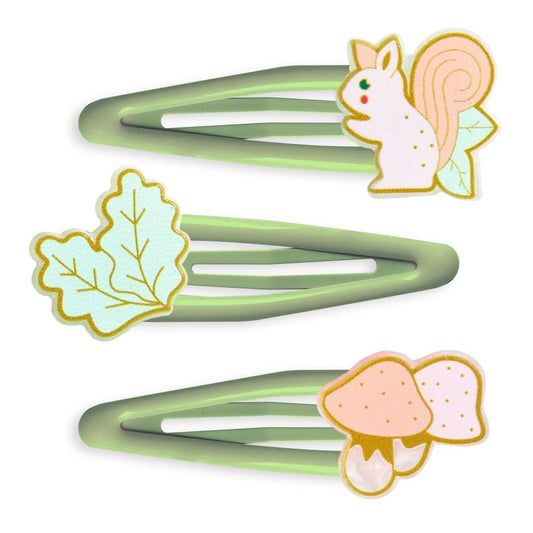 Three green hair clips with animal-themed decorations on a white background