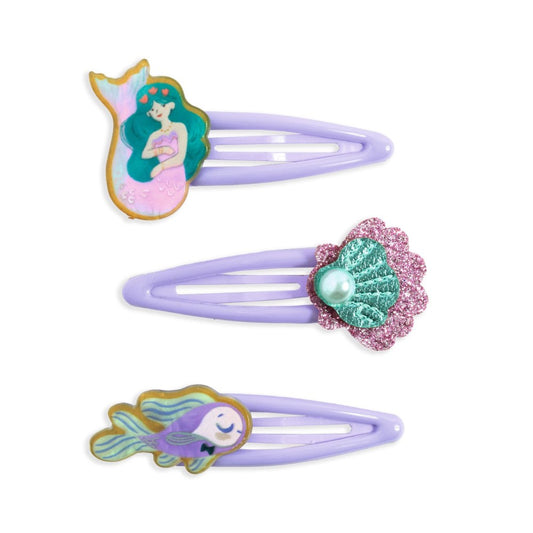 Set of three mermaid-themed hair clips on a white background