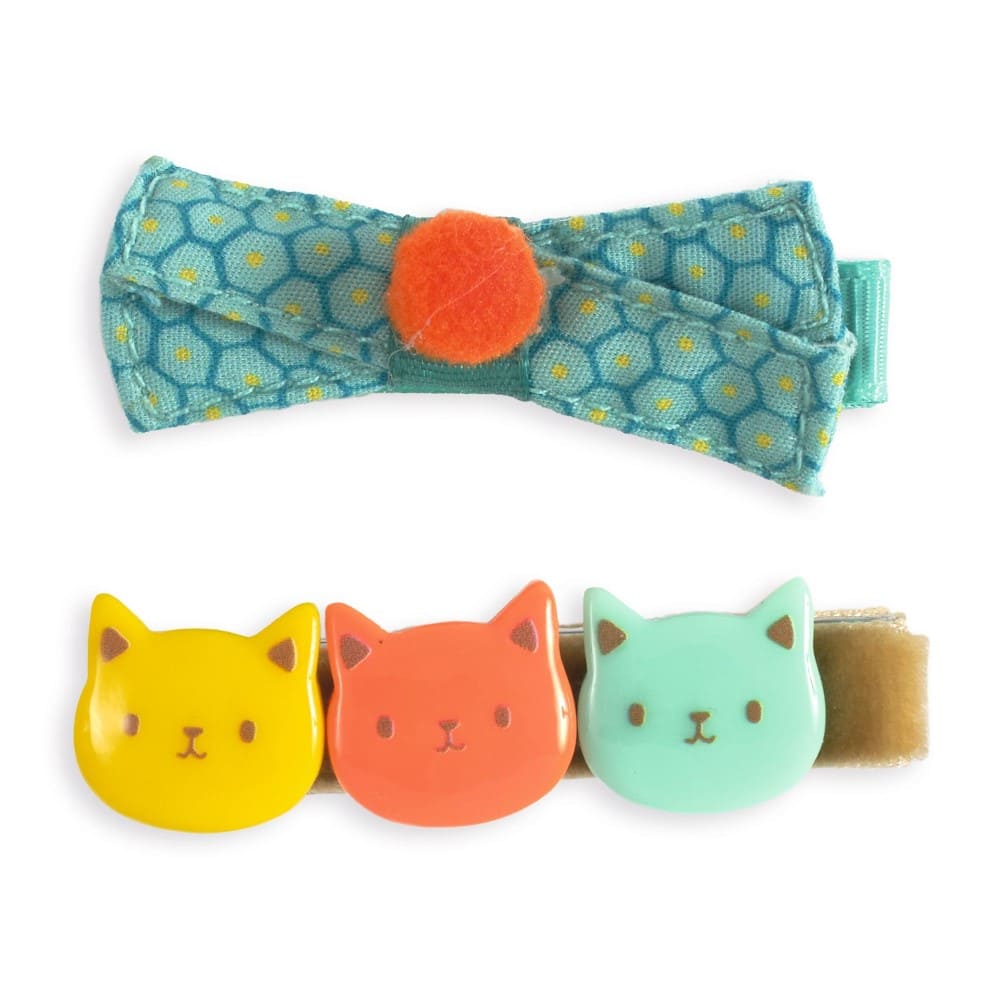 Colorful cat-themed hair clips with a bow on a white background