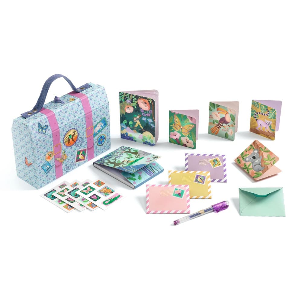 Collection of stationery items including a suitcase, notebooks, cards, and stickers on a white background