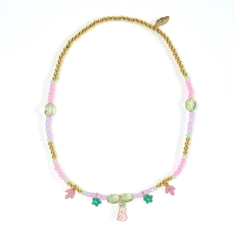 Necklace with pink beads, gold chain, and colorful charms on a white background
