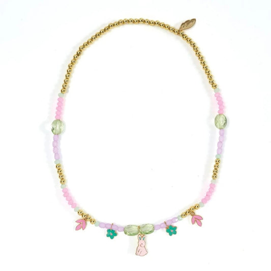 Necklace with pink beads, gold chain, and colorful charms on a white background