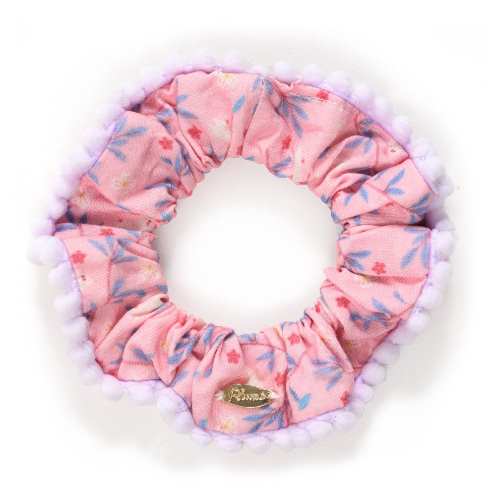 Pink floral scrunchie on a white background