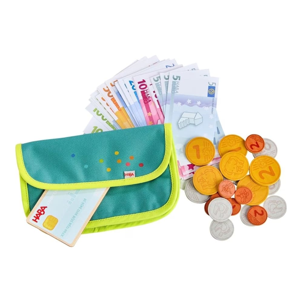Teal and green toy money pouch with toy currency on a white background