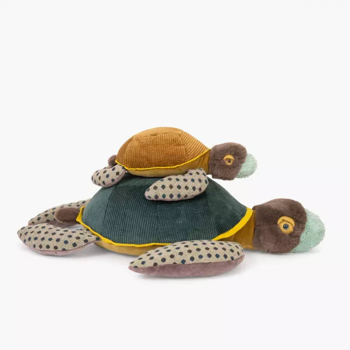 Plush turtle toy with a green shell on a white background