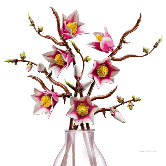 Artificial flower branch with pink flowers and yellow centers in a clear vase on a white background