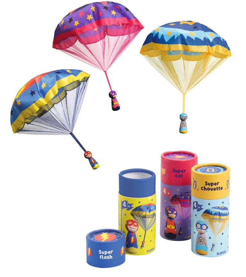 Colorful toy paragliders with packaging on a white background