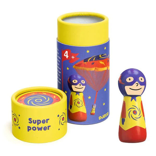 Superhero-themed toy with packaging on a white background
