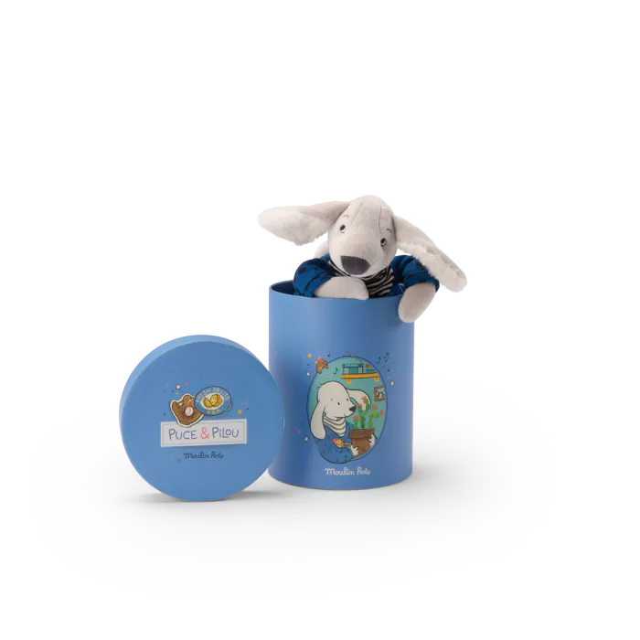 Stuffed animal toy in a blue cylindrical container with Puce & Pilou branding on a white background