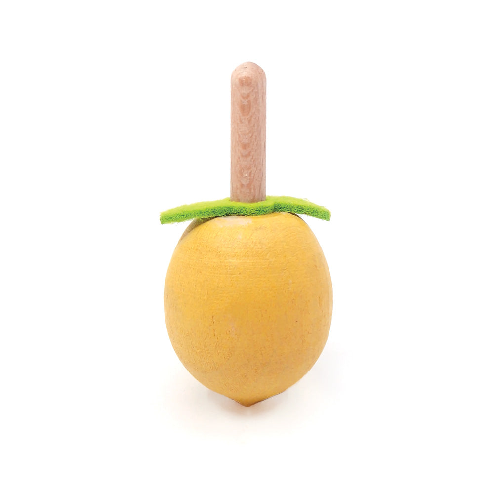 Toy apple with a stick on a white background
