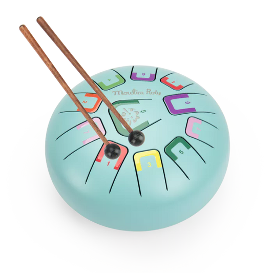 Colorful wooden drum with drumsticks on a white background